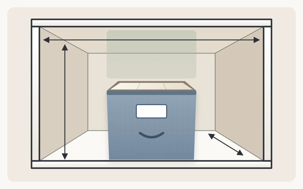 Front view of a closet shelf with a bin on it and three arrows marking the width, depth and height of the opening