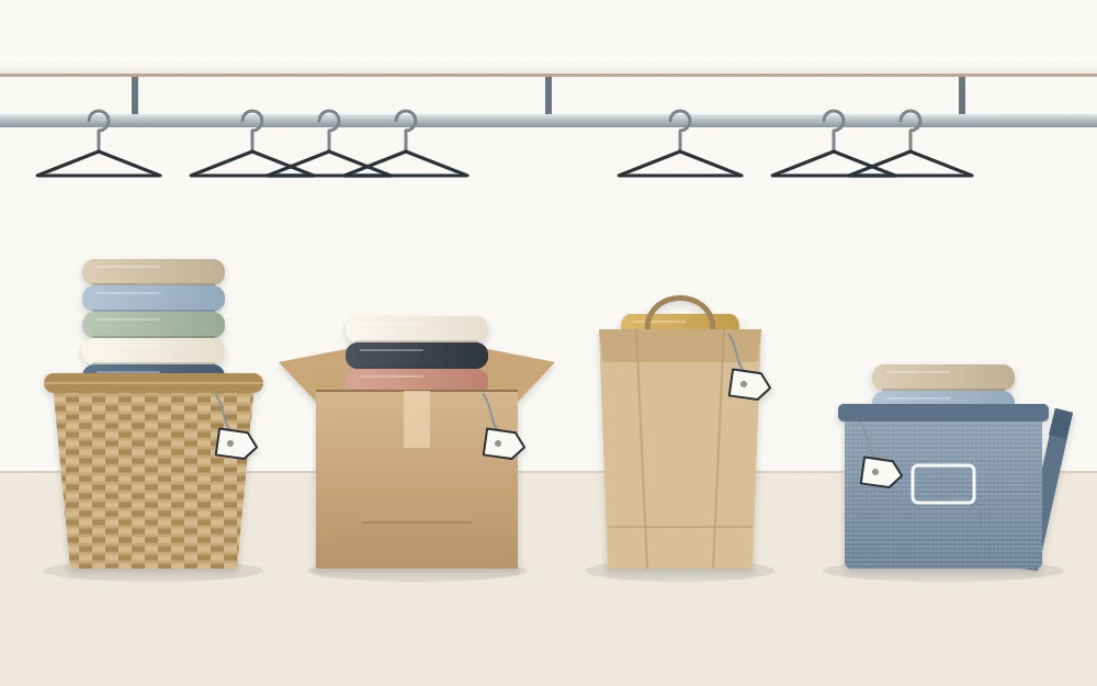 Four open containers in a row on a pale floor, each holding folded clothing and carrying a blank tag